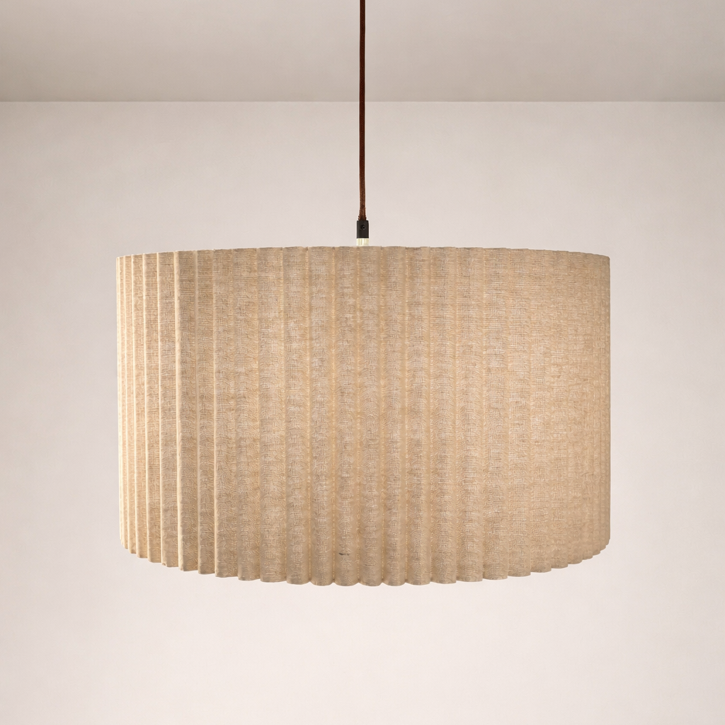 Beige pendant lamp with a textured shade on a neutral background