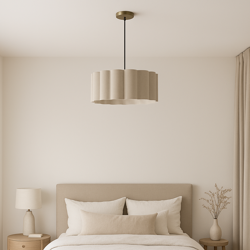 Neatly made bed in a bedroom with neutral tones and minimal decor.