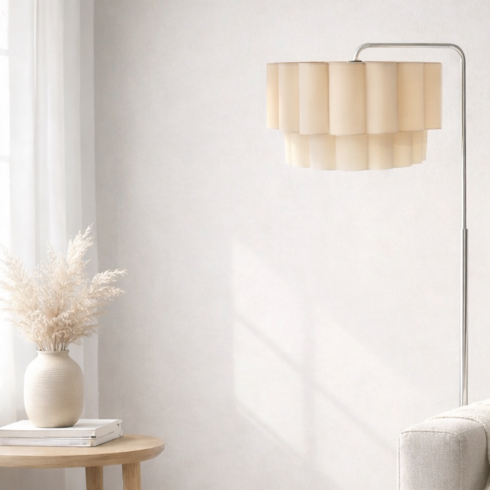 Modern living room with a beige sofa, wooden side table, and floor lamp.