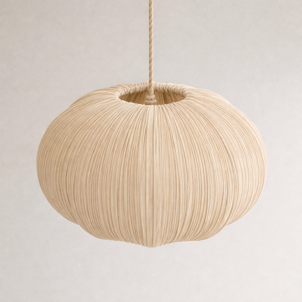 Beige pendant lamp with a textured design on a plain background