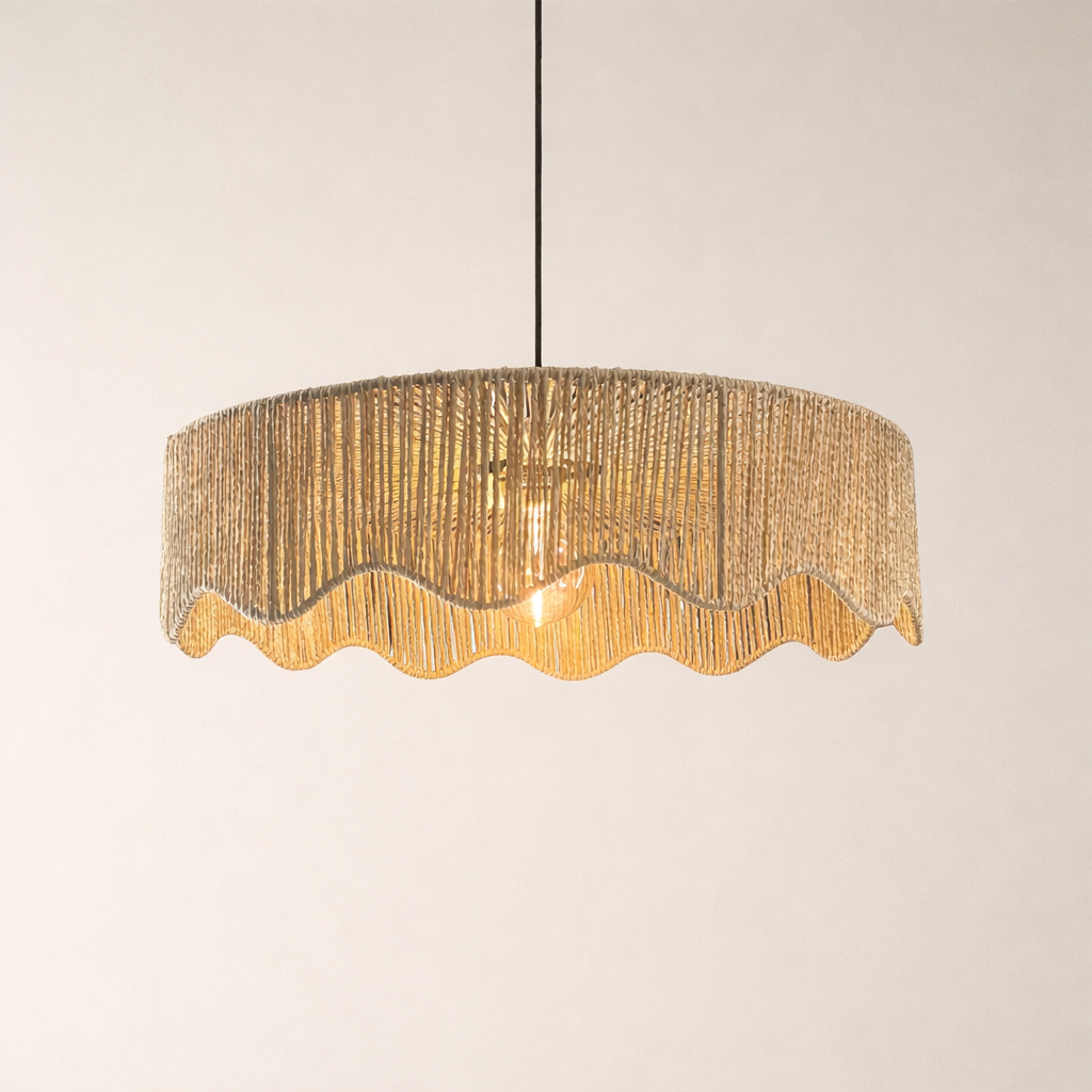 Textured pendant light with wavy edge on a plain background