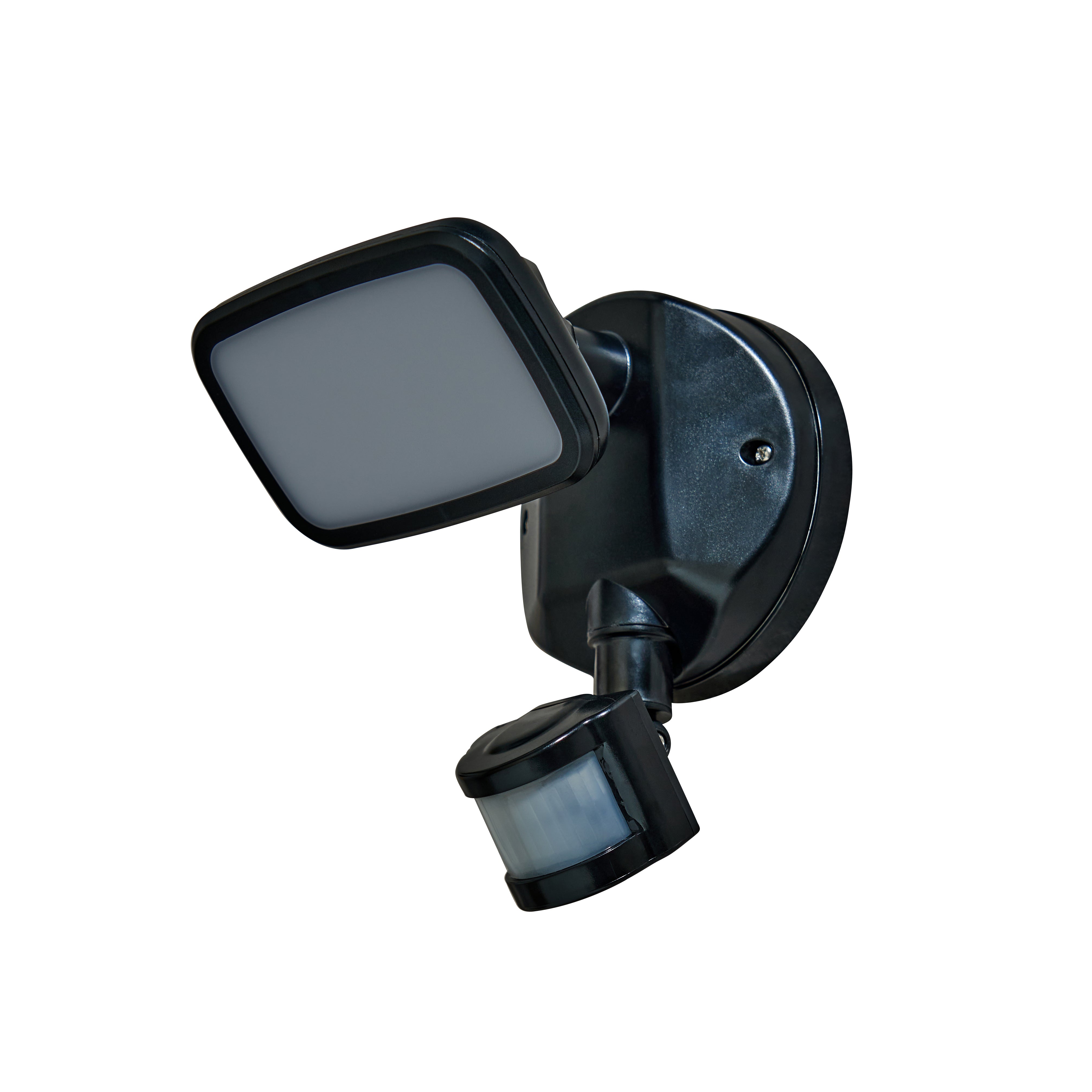 Black outdoor security light with motion sensor on a white background
