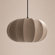 Pendant light with a ribbed design on a beige background