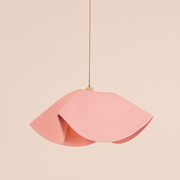 Pink pendant lamp on a beige background