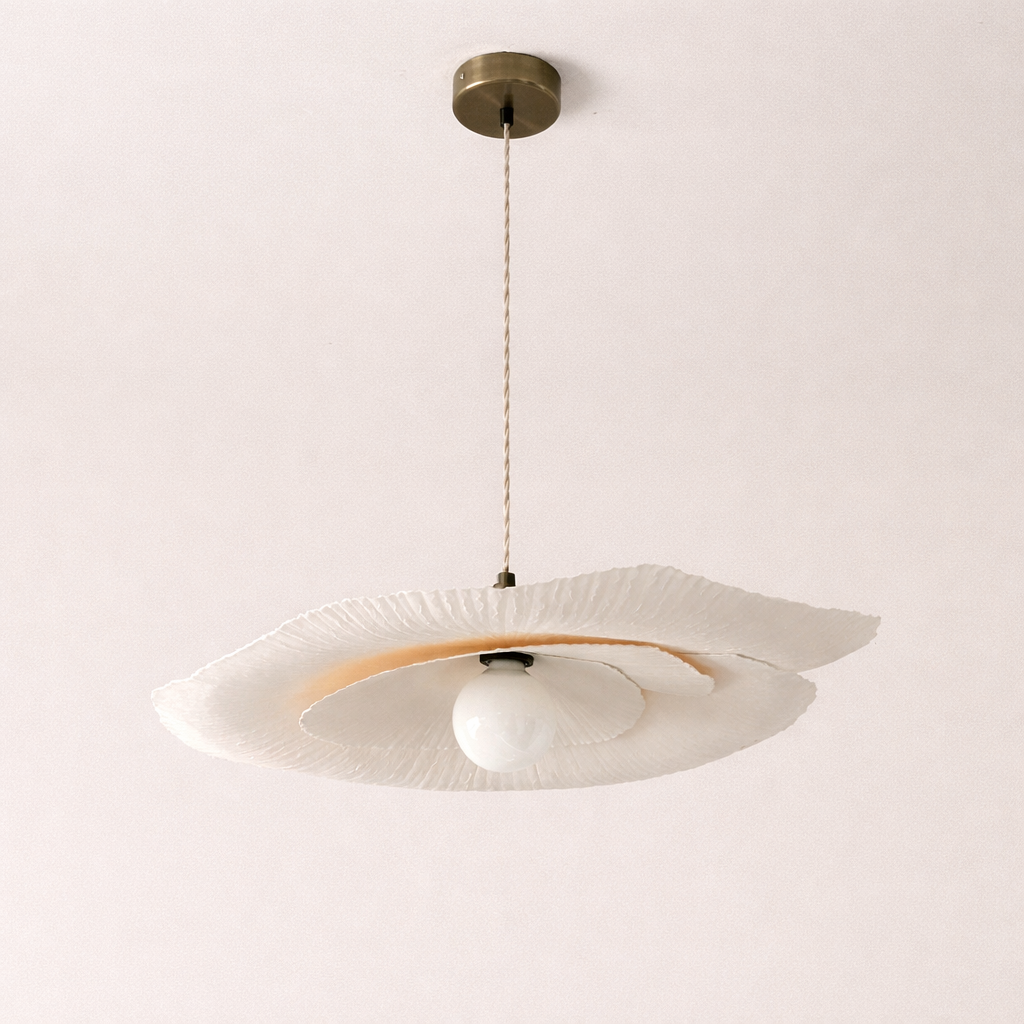 Ceiling light fixture with a white shade on a plain background