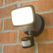 Security camera mounted on a brick wall
