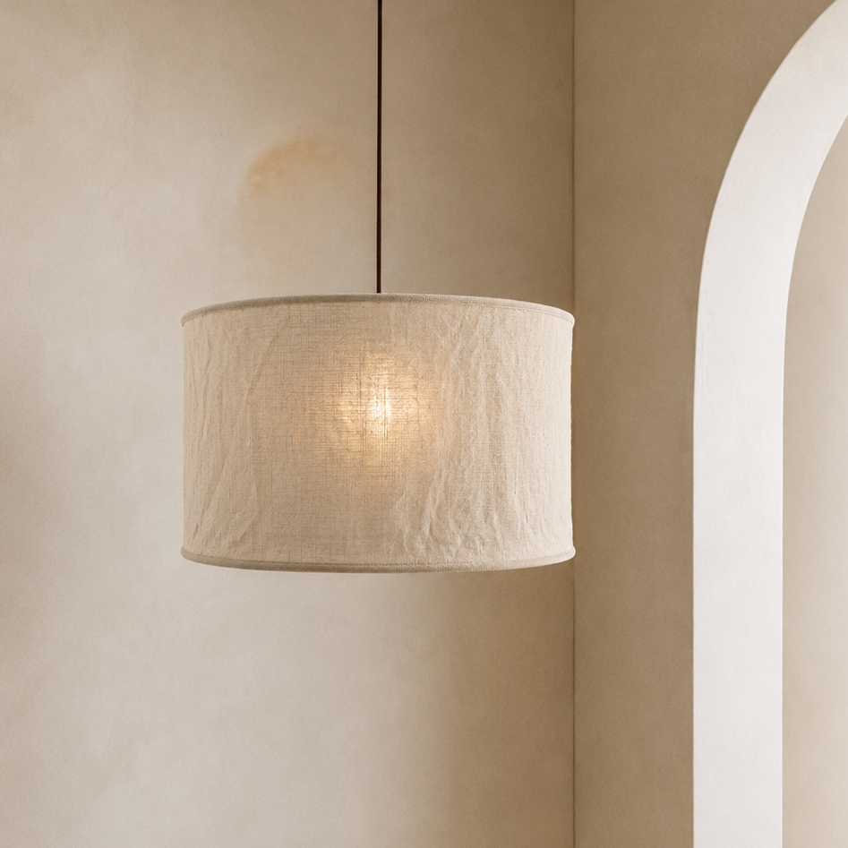 Beige pendant lamp hanging in a room with a neutral color palette