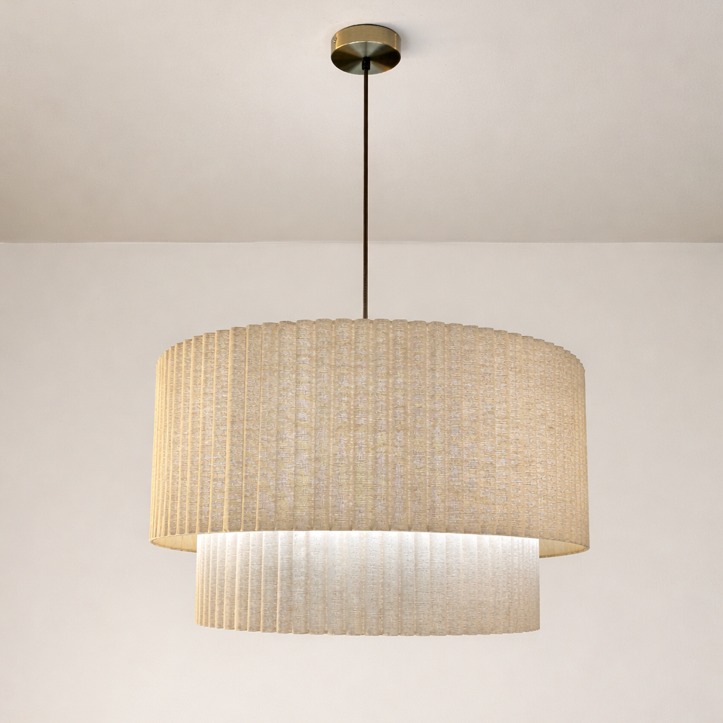 Ceiling light fixture with a textured beige shade on a plain background