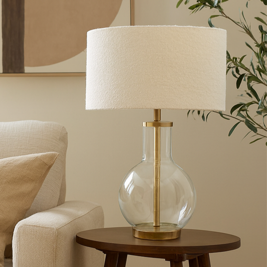 Living room with beige sofa, wooden side table, and decorative lamp.