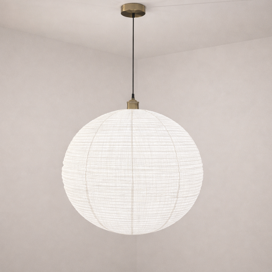 Spherical pendant light with white shade and gold fixture on a plain wall.