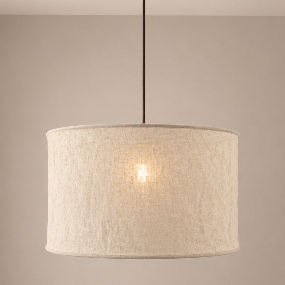 Textured beige pendant light against a neutral background