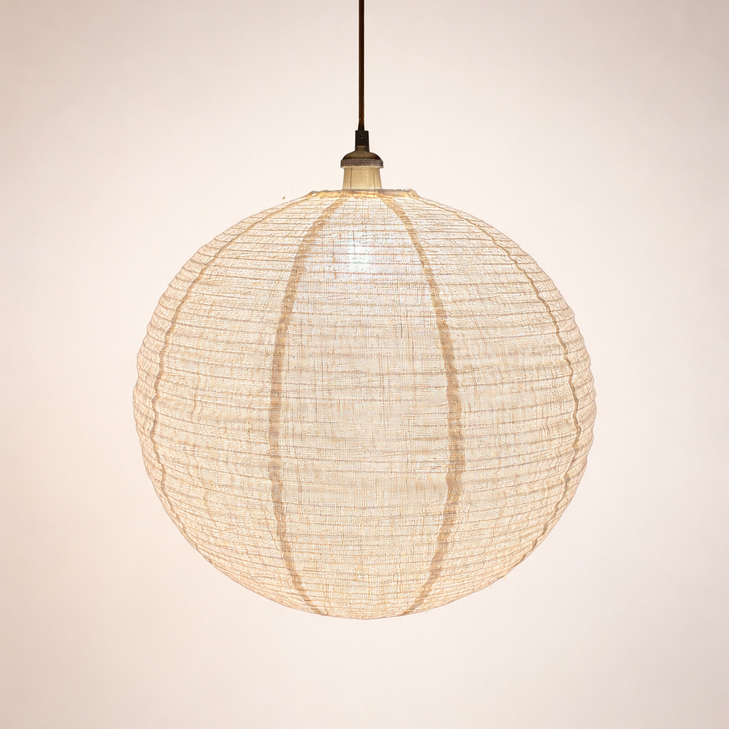 Woven spherical pendant light on a plain background