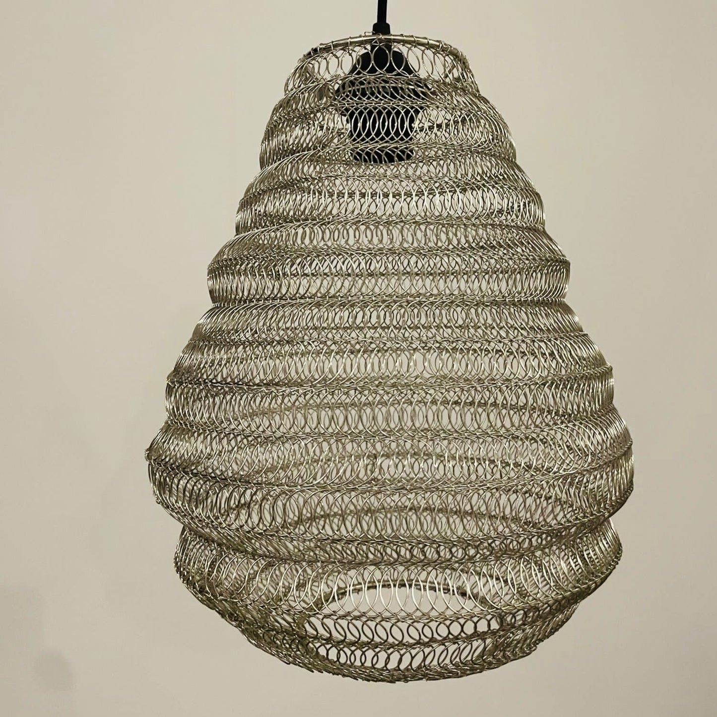Bring a Moroccan twist to your home décor with the delicately crafted Casablanca ceiling light. Made in an intricate design from silver metal wire this large statement light would look fabulous in both living and dining spaces, as well as bedrooms. When switched on the light shines through the shade creating a spectacular pattern on the ceiling and walls.
