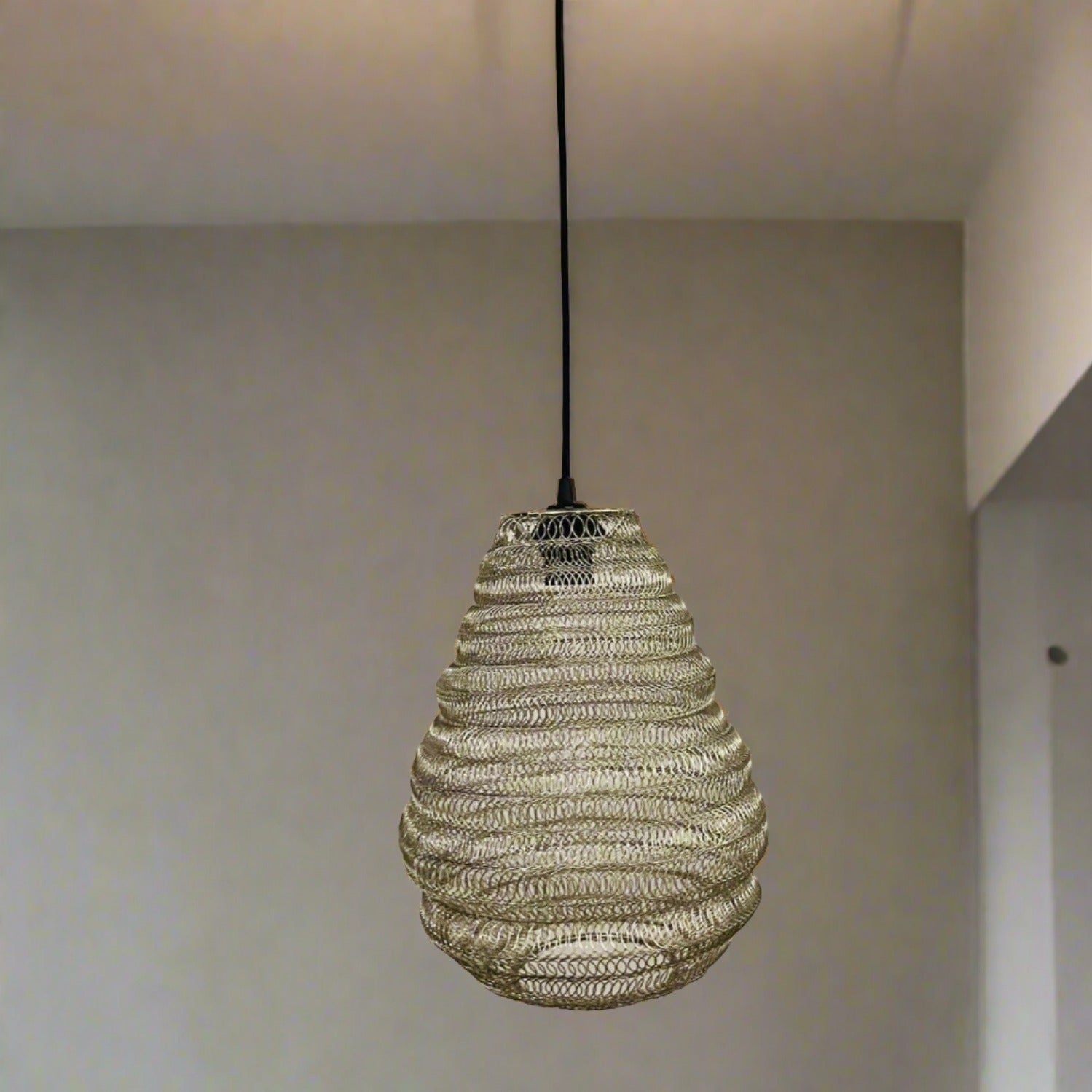 Bring a Moroccan twist to your home décor with the delicately crafted Casablanca ceiling light. Made in an intricate design from silver metal wire this large statement light would look fabulous in both living and dining spaces, as well as bedrooms. When switched on the light shines through the shade creating a spectacular pattern on the ceiling and walls.