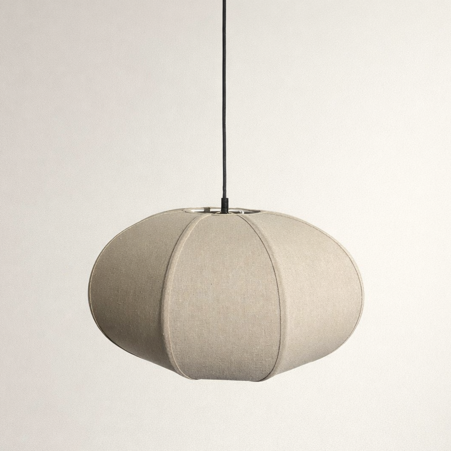 Beige pendant light with gold fixture on a plain background
