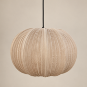 A spherical pleated pendant light in a natural beige wood finish, suspended by a black cord against a solid beige background.