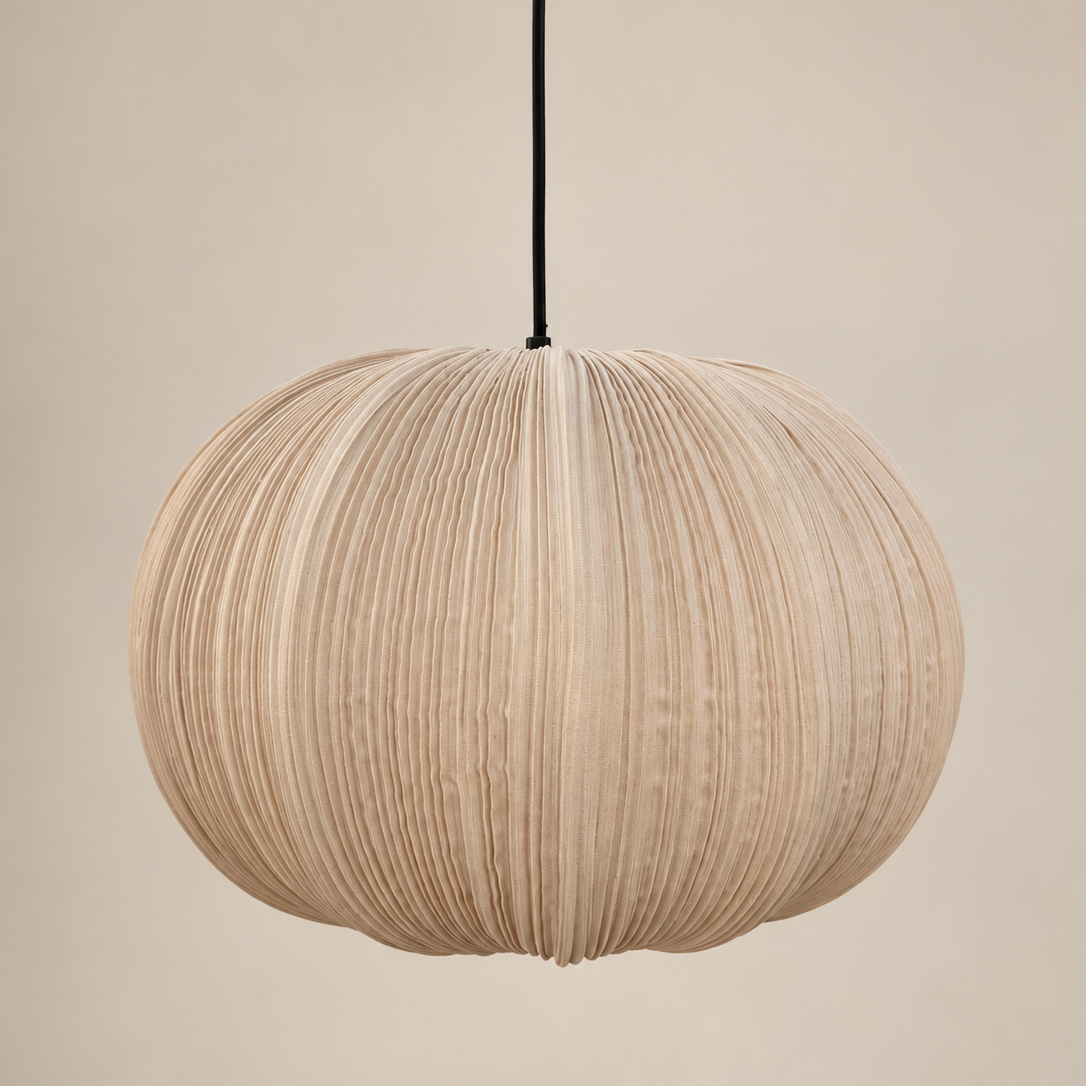 A spherical pleated pendant light in a natural beige wood finish, suspended by a black cord against a solid beige background.