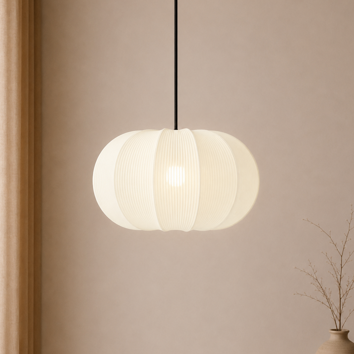 White pendant light hanging against a beige wall with a vase on the right.