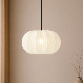 White pendant light hanging against a beige wall with a vase on the right.
