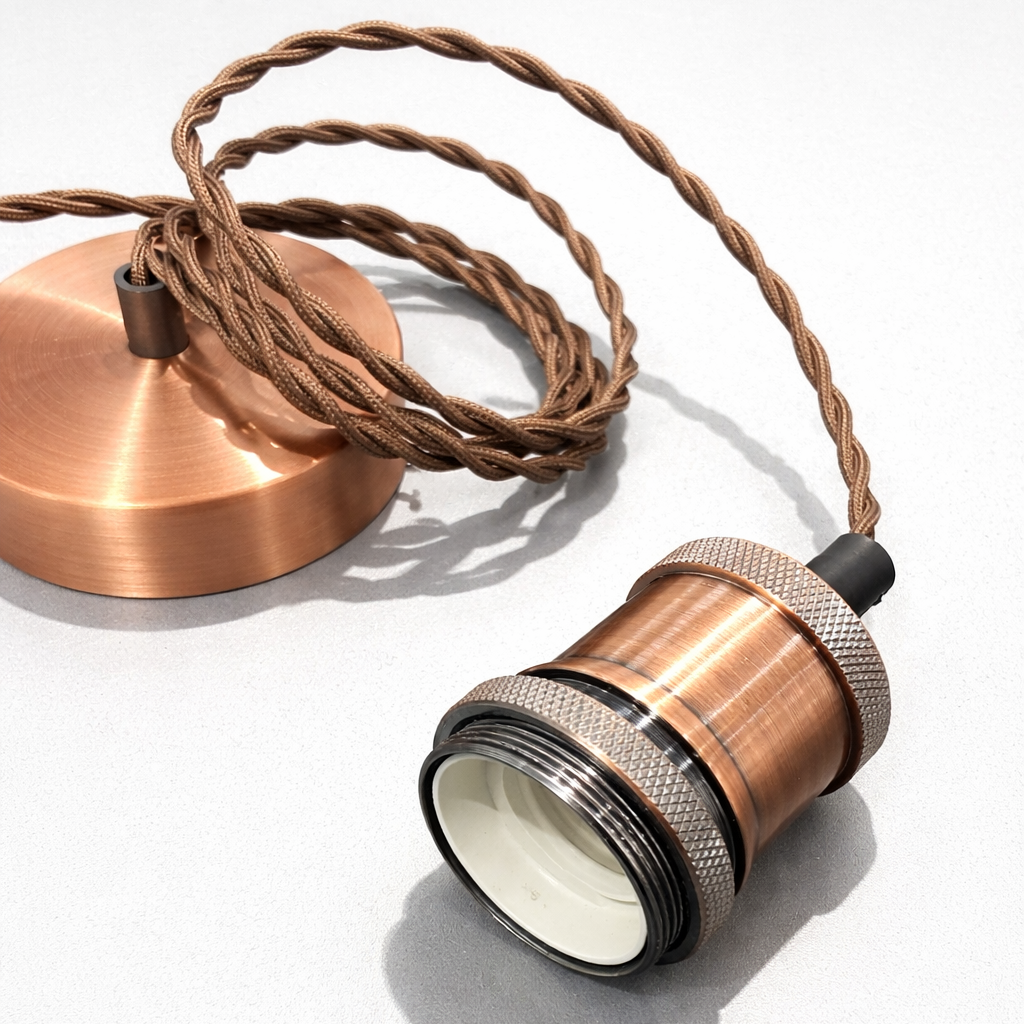 Copper pendant light fixture on a white background