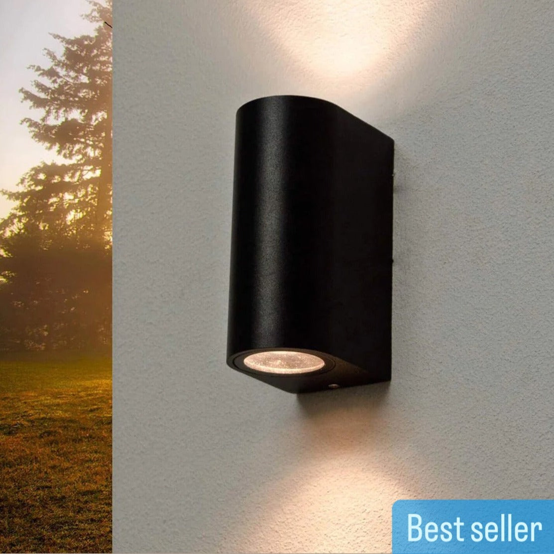 Our Tiago up and down wall light would look perfect in a modern or more traditional home design. Outdoor sconces can provide ambient light in your garden, at your front door or on your terrace, as well as a great security solution. It is designed for durability and longevity with its robust material producing a fully weather and waterproof lighting fixture. 
