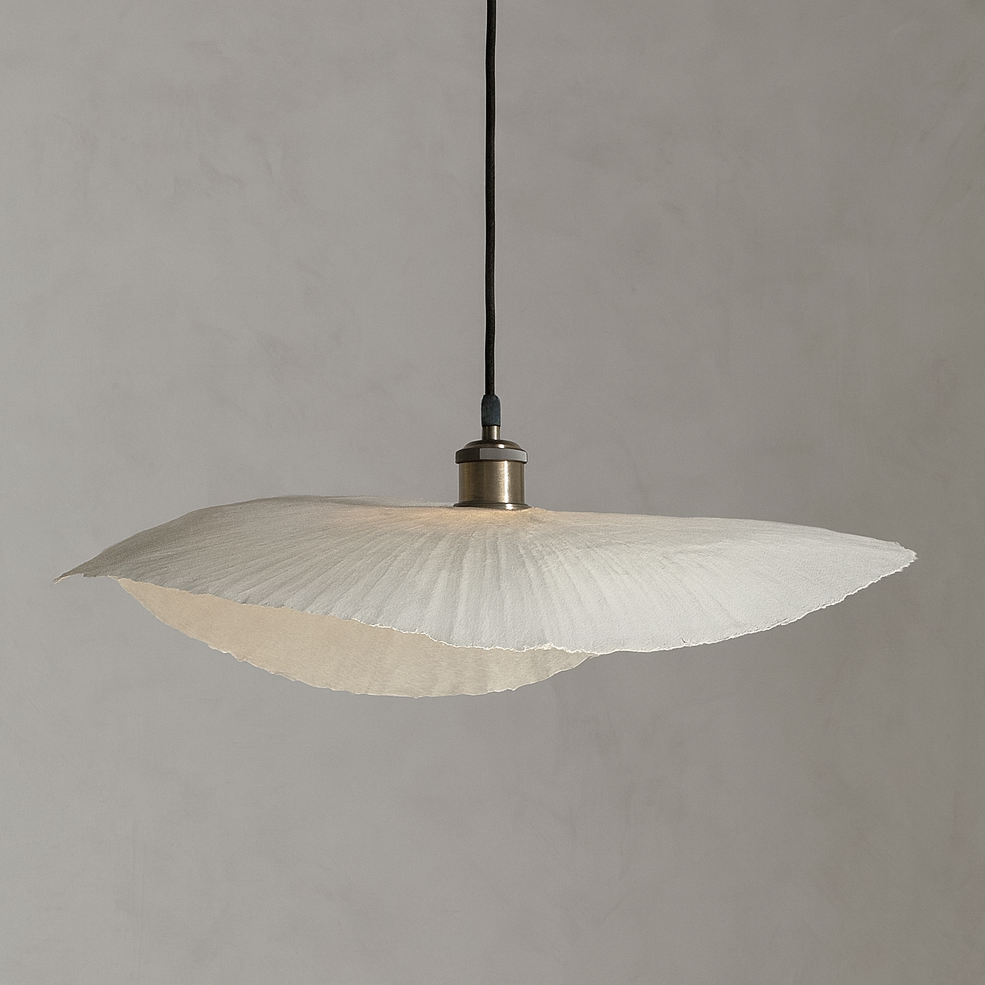 Pendant light with ribbed glass shade on a gray background