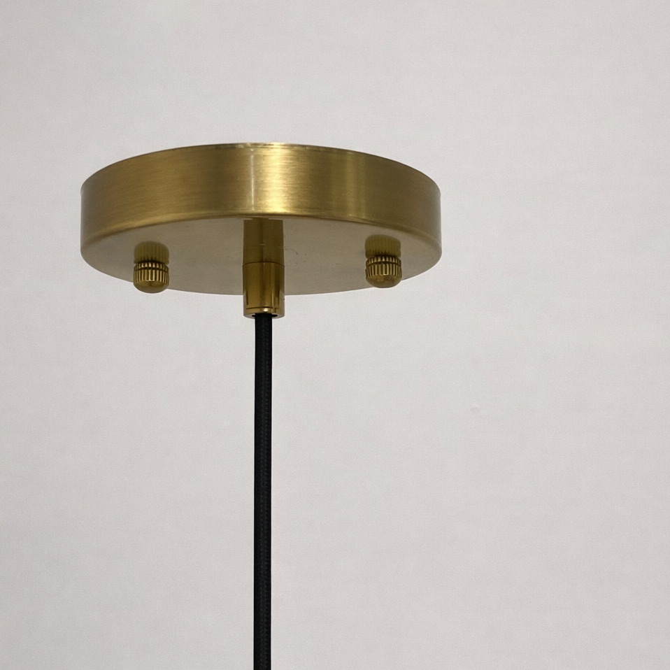 Brass ceiling light fixture on a white background