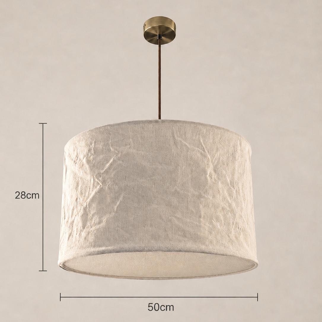 Ceiling light fixture with textured white shade on a beige background