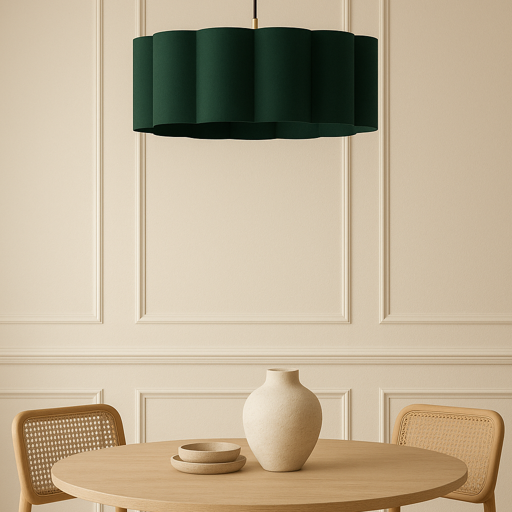 Dining area with a round table, chairs, and a green pendant light.