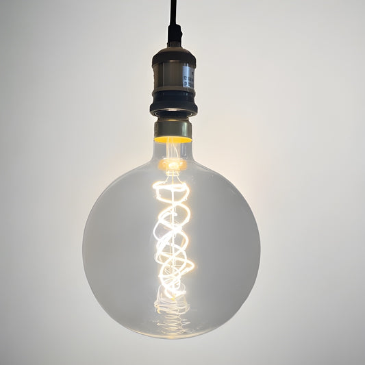 Our Large clear glass filament E27 LED Bulbs provide a unique aesthetic, blending seamlessly into many decors. Our anti-glare round globes give off a warm white light that creates a subtle ambiance for a vintage look. With low glare and maximum style, this energy-saving lamp is perfect for exposed lighting designs. 