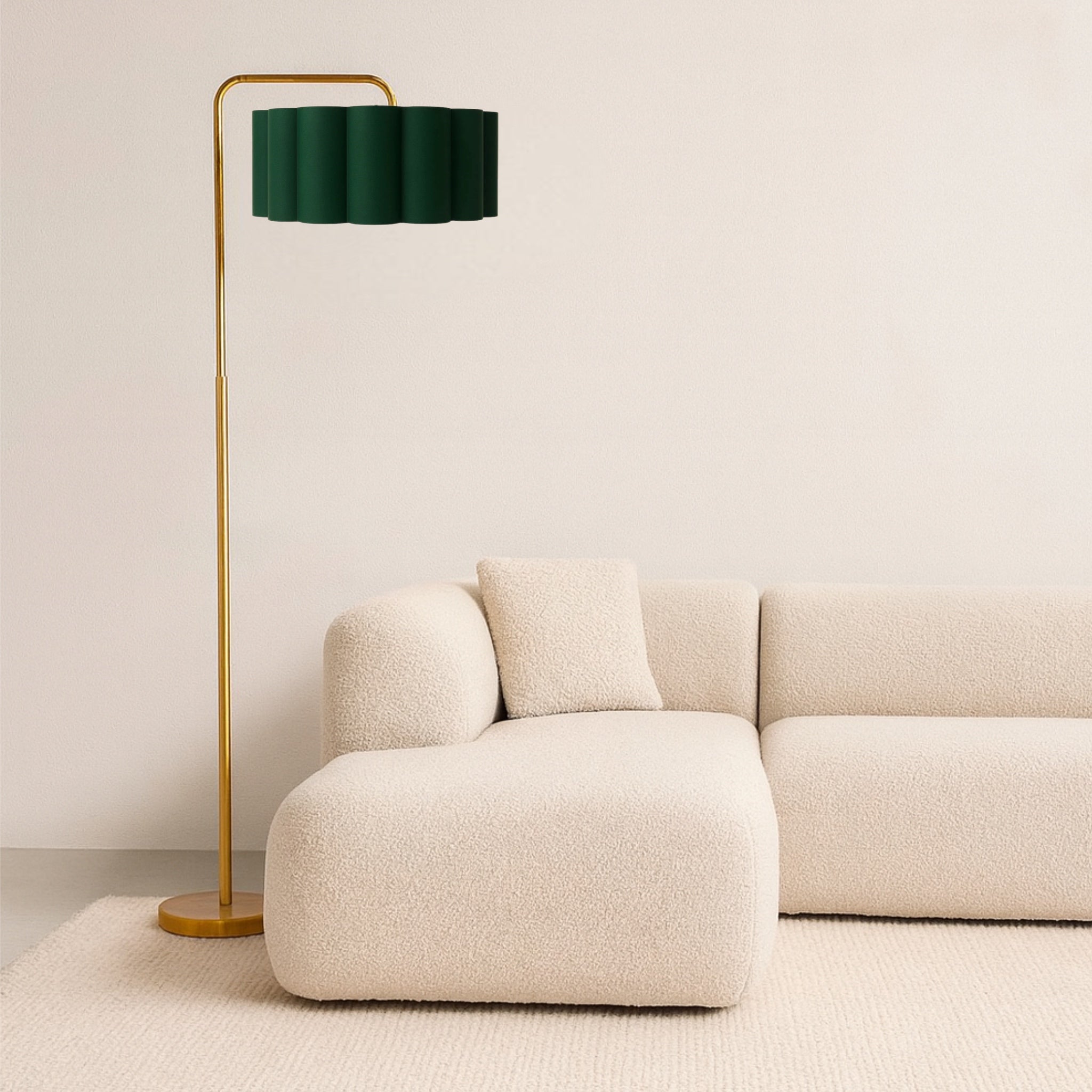 Beige sofa with a green floor lamp against a beige wall