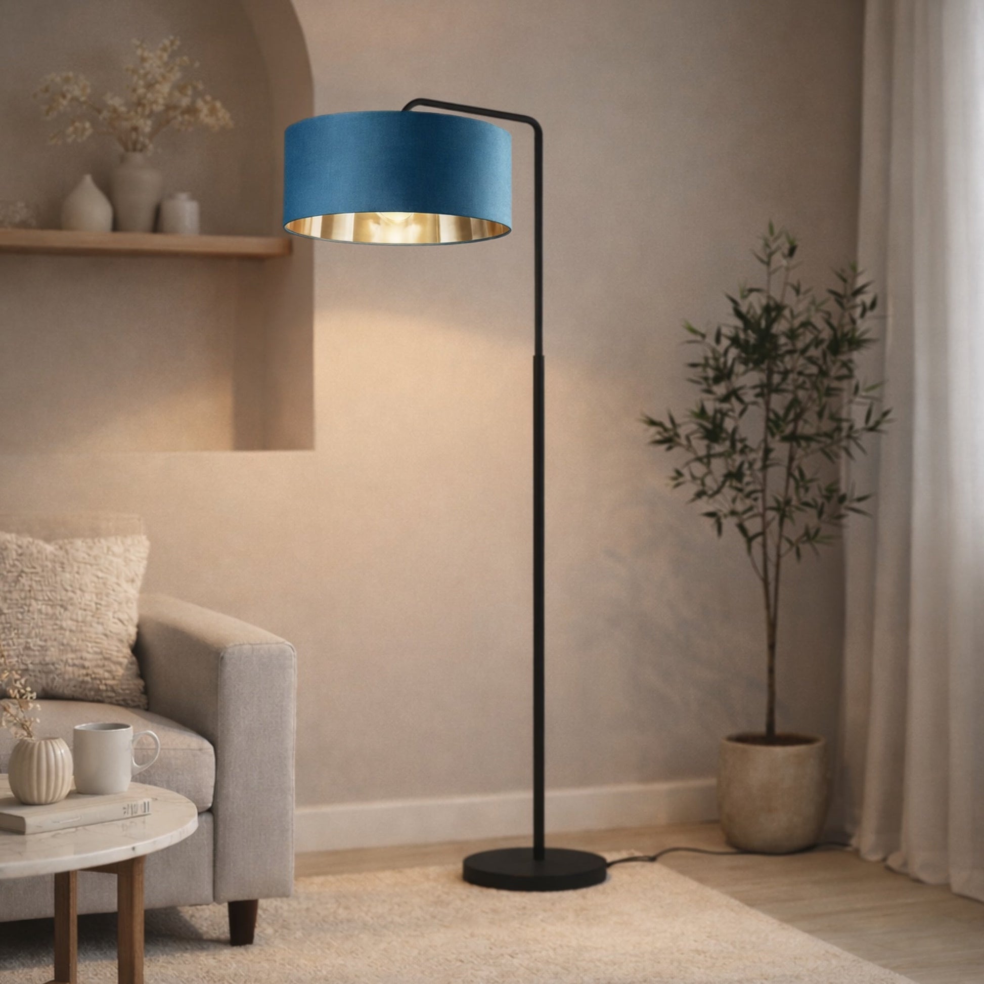 Blue floor lamp in a living room setting with a plant and sofa.