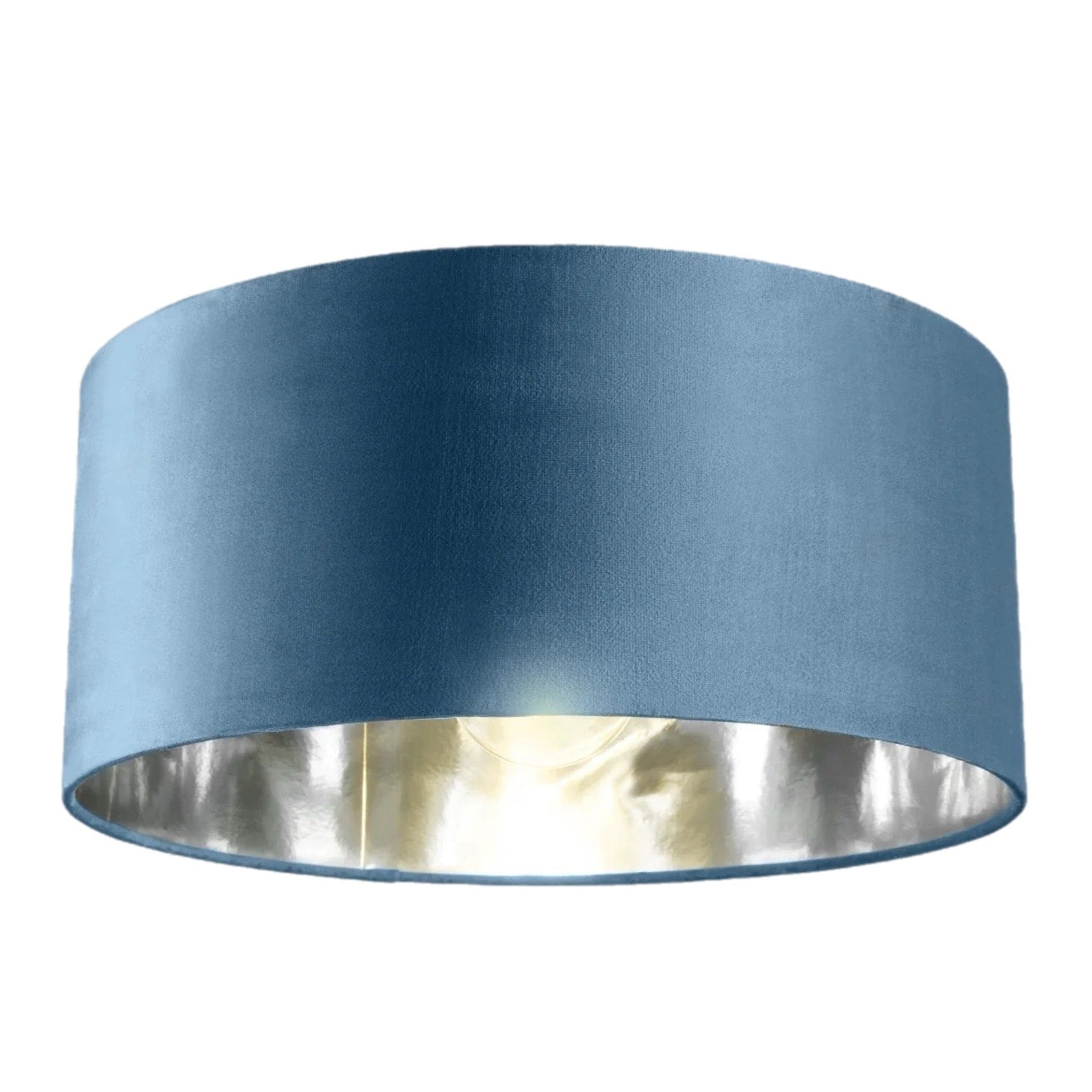 Blue lampshade with a metallic interior on a white background