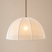 Beige pendant light with a textured shade on a beige background