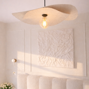 Modern ceiling light fixture in a bedroom setting with soft lighting.