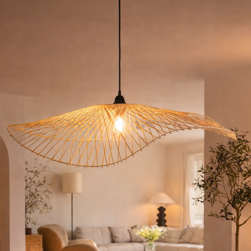 Modern living room with a wicker pendant light, comfortable furniture, and decorative elements.