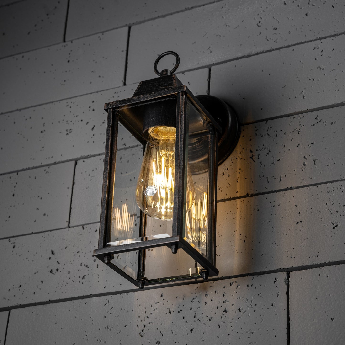 If you’re looking for a modern take on a traditional outdoor wall light, this glass coach wall light is perfect for adding style and protection for your home. This classic lantern light is designed with a contemporary twist, styled with a cuboid shape and fitted with glass windows that allow the light to shine effectively.&nbsp;