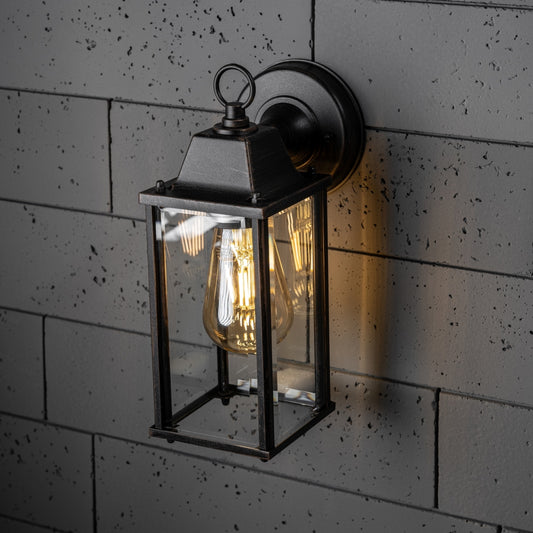 If you’re looking for a modern take on a traditional outdoor wall light, this glass coach wall light is perfect for adding style and protection for your home. This classic lantern light is designed with a contemporary twist, styled with a cuboid shape and fitted with glass windows that allow the light to shine effectively.&nbsp;