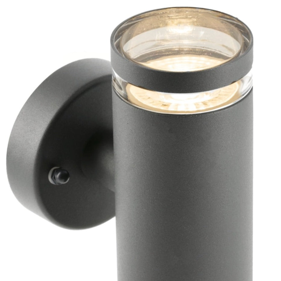 Our Jennifer dark grey outdoor wall mounted up and down cylinder outdoor light would look perfect in a modern or more traditional home design. Outside wall lights can provide atmospheric light in your garden, at the front door or on the terrace as well as a great security solution. It is designed for durability and longevity with its robust material producing a fully weatherproof and water resistant light fitting