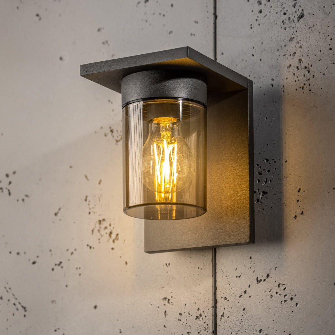 If you’re looking for a modern take on a traditional outdoor wall light, this&nbsp;anthracite wall light is perfect for adding style and protection for your home. This classic design with a contemporary twist, styled with a metal square shape and fitted with a smoked cylinder diffuser that allow the light to shine effectively