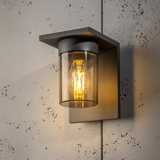 If you’re looking for a modern take on a traditional outdoor wall light, this&nbsp;anthracite wall light is perfect for adding style and protection for your home. This classic design with a contemporary twist, styled with a metal square shape and fitted with a smoked cylinder diffuser that allow the light to shine effectively