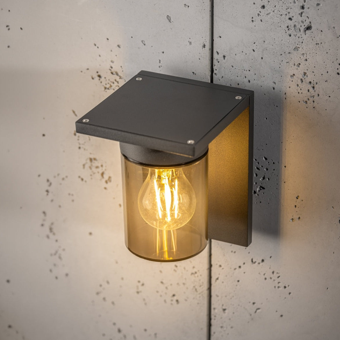 If you’re looking for a modern take on a traditional outdoor wall light, this&nbsp;anthracite wall light is perfect for adding style and protection for your home. This classic design with a contemporary twist, styled with a metal square shape and fitted with a smoked cylinder diffuser that allow the light to shine effectively