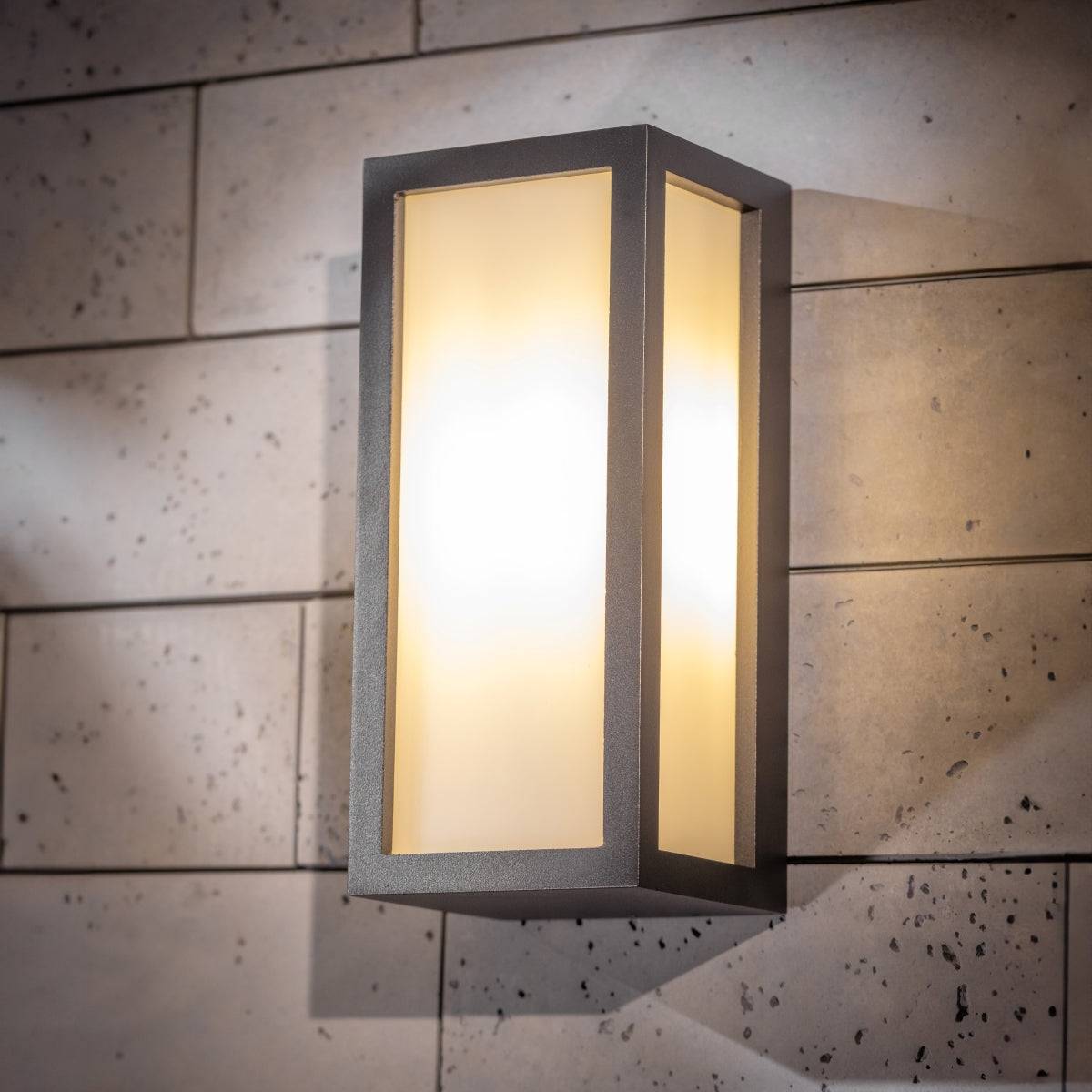 If you’re looking for a modern take on a traditional outdoor wall light, this black aluminium rectangle wall light is perfect for adding style and protection for your home. This classic design with a contemporary twist, styled with a metal rectangle shape and fitted with opal diffusers also contains an imposing black finish