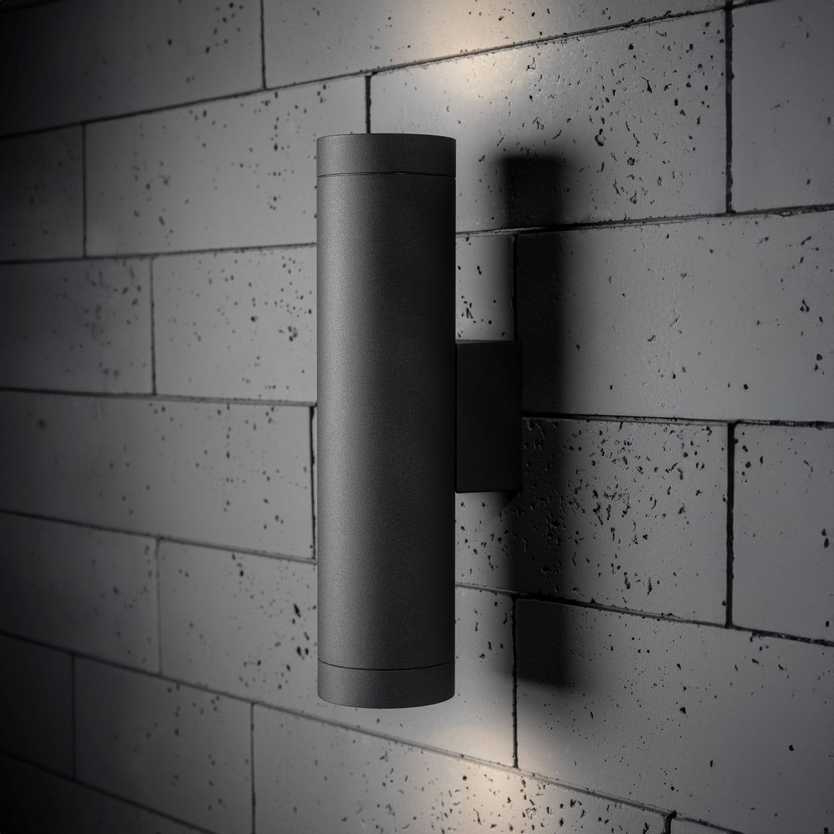 Our Lucas grey anthracite extra long outdoor wall mounted up and down cylinder outdoor light would look perfect in a modern or more traditional home design. Outside wall lights can provide atmospheric light in your garden, at the front door or on the terrace as well as a great security solution. It is designed for durability and longevity with its robust material producing a fully weatherproof and water resistant light fitting.