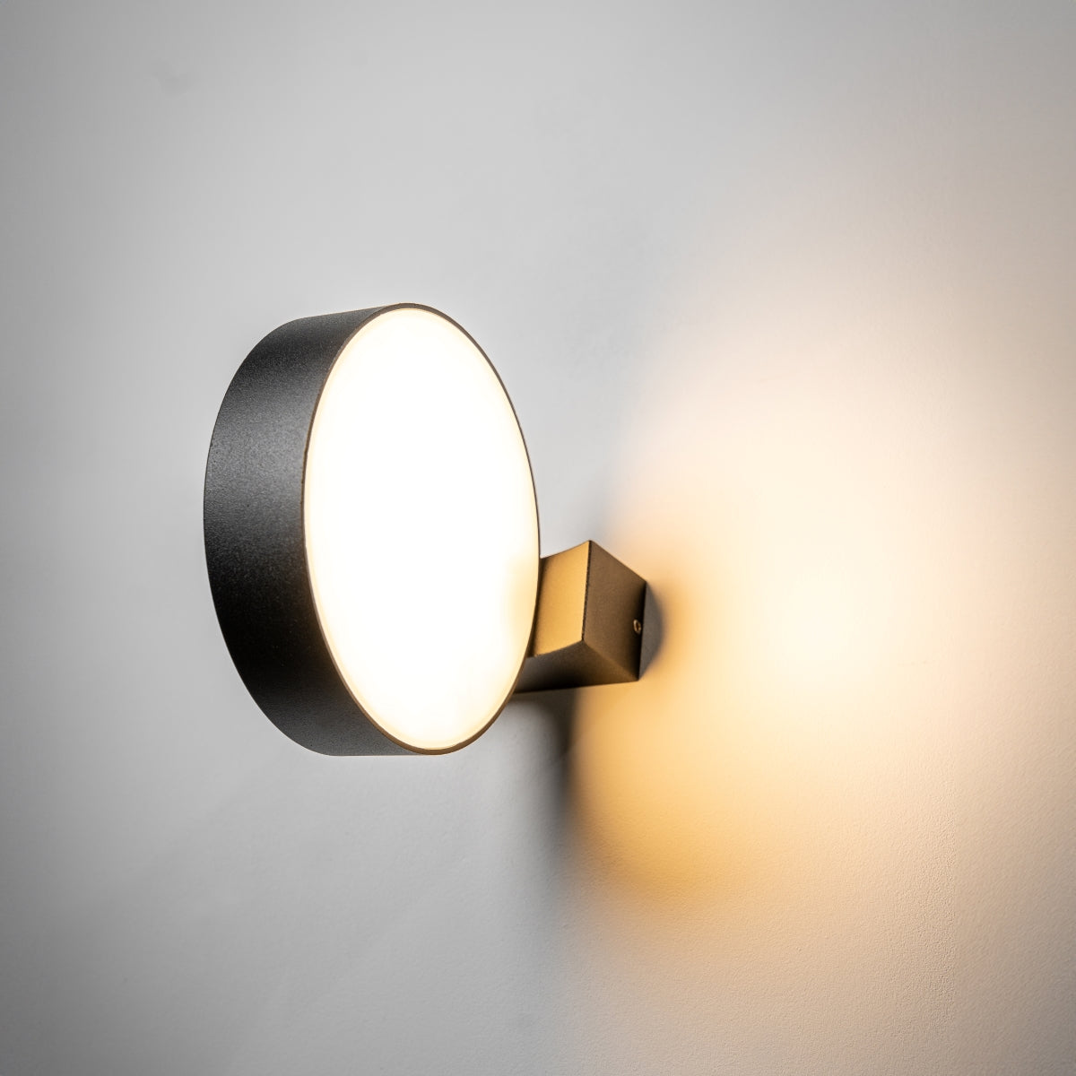 Our Darcy black die cast aluminium wall mounted round outdoor light with built in LED's would look perfect in a modern or more traditional home design. Comes with an adjustable head to allow you to angle the light output to your desired look.