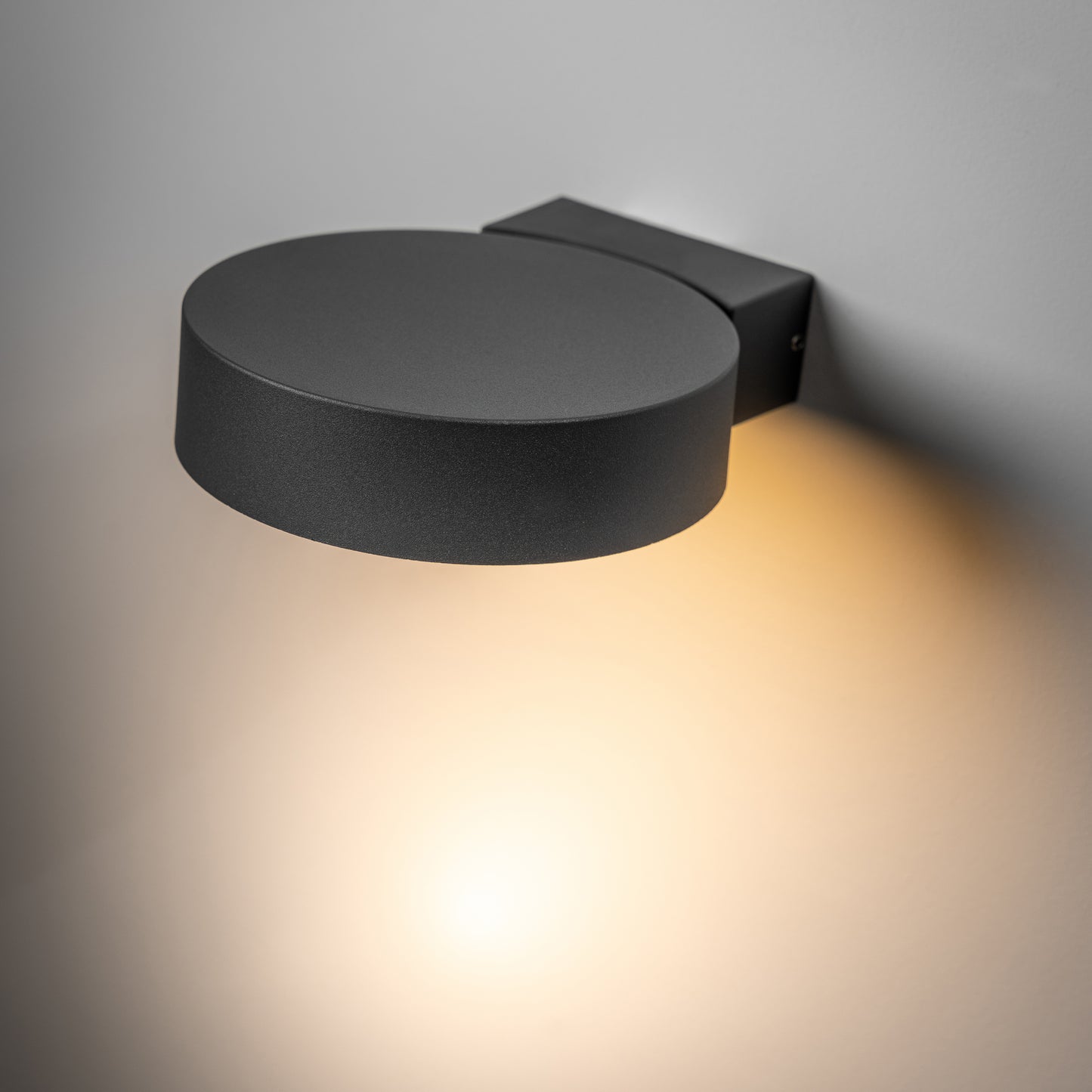 Our Darcy anthracite grey die cast aluminium wall mounted round outdoor light with built in LED's would look perfect in a modern or more traditional home design. Comes with an adjustable head to allow you to angle the light output to your desired look.