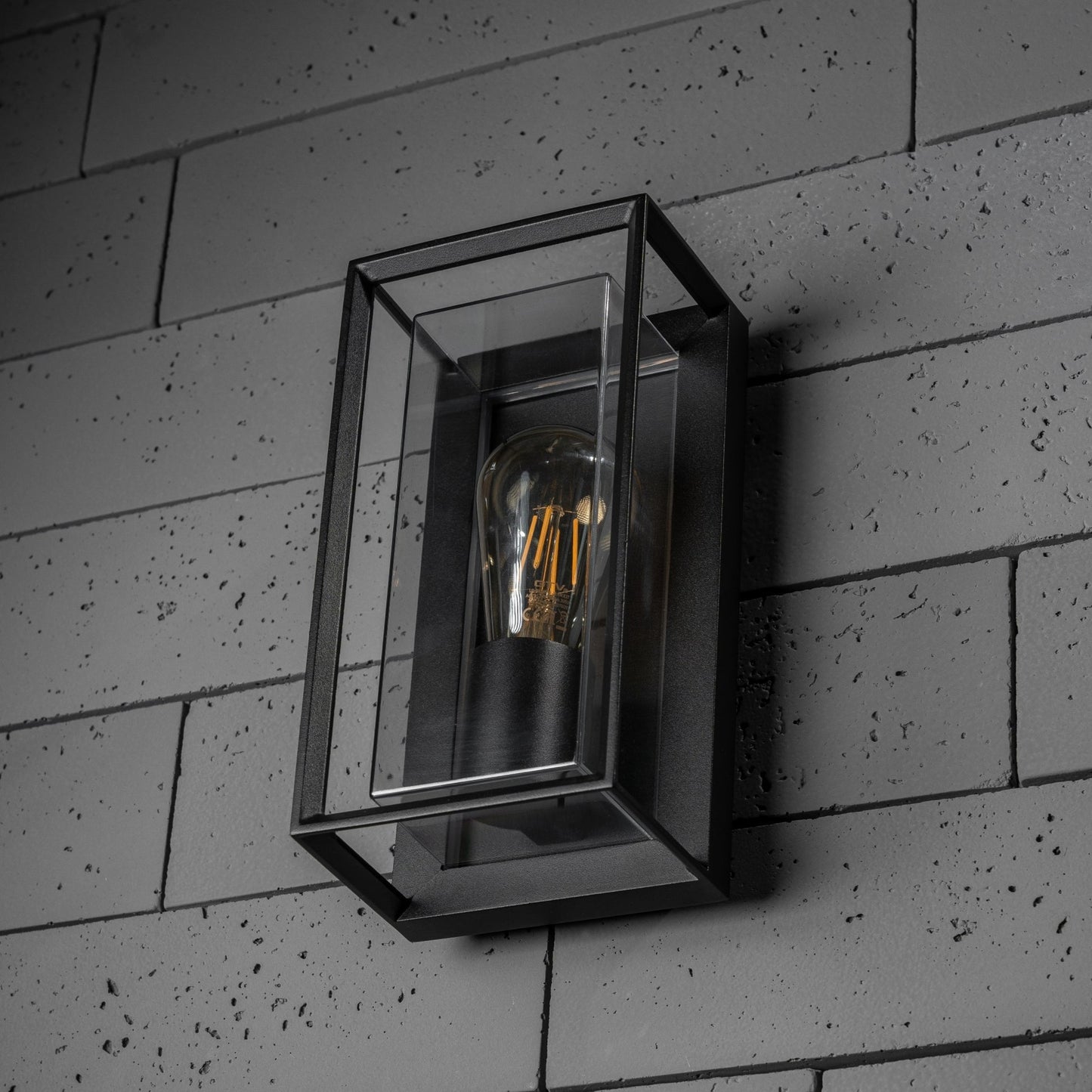 Our Floriana black aluminium outdoor wall mounted lantern outdoor light with clear polycarbonate diffusers would look perfect in a modern or more traditional home design.