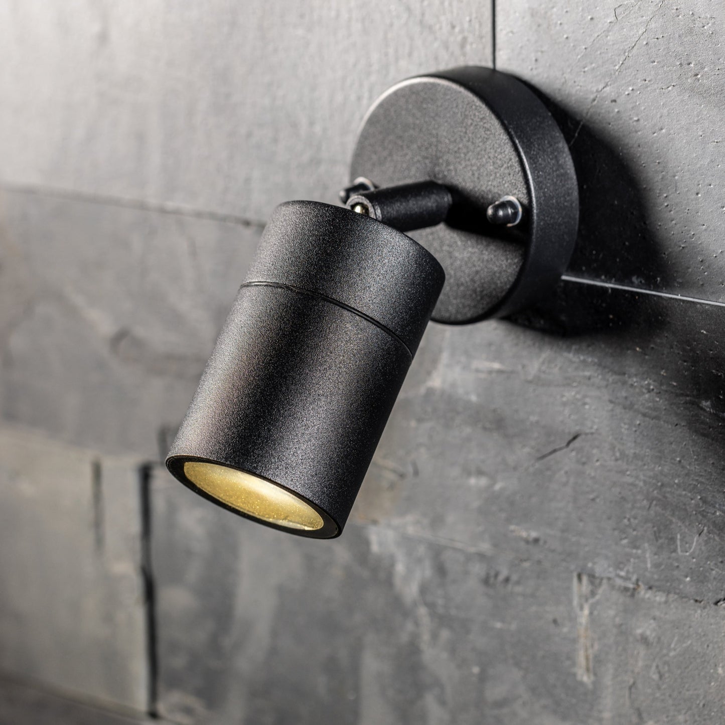 Our Leon outdoor single down light is modern and stylish in its appearance.  It comes in a adjustable cylinder design mounted on a circular back plate and clear glass diffuser. It is designed for durability and longevity with its robust material producing a fully weatherproof and water resistant light fitting