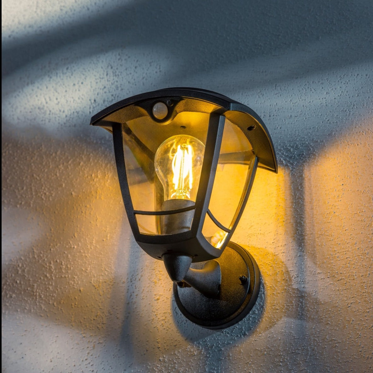 Create an aesthetically pleasing lighting system around your home with our Lara solar lantern light for your walls. This product is featured as an elegant and traditional lantern wall light design, constructed from black polycarbonate and fitted with clear polycarbonate diffusers. The Lara wall light comes complete with an integrated filament warm white LED bulb and integrated PIR motion sensor