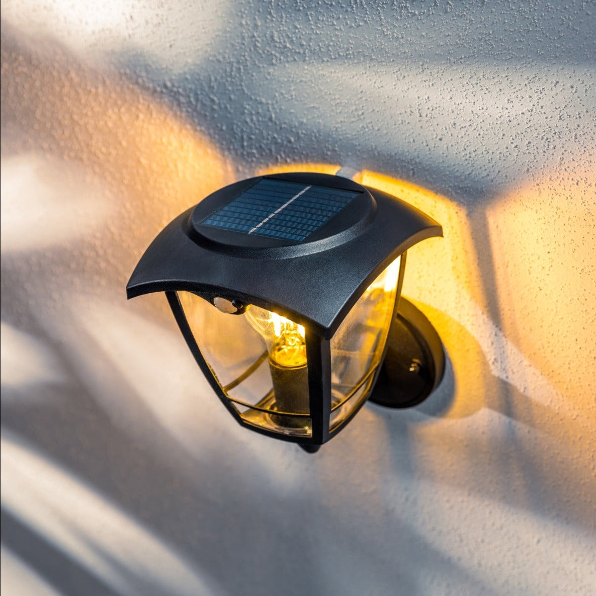 Create an aesthetically pleasing lighting system around your home with our Lara solar lantern light for your walls. This product is featured as an elegant and traditional lantern wall light design, constructed from black polycarbonate and fitted with clear polycarbonate diffusers. The Lara wall light comes complete with an integrated filament warm white LED bulb and integrated PIR motion sensor